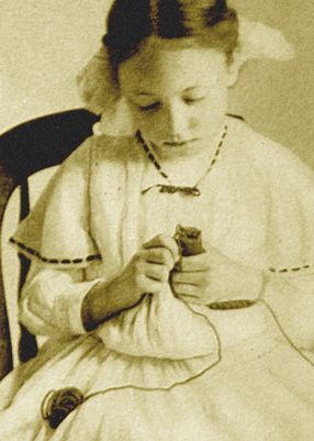 girl spool knitting in early 1900s