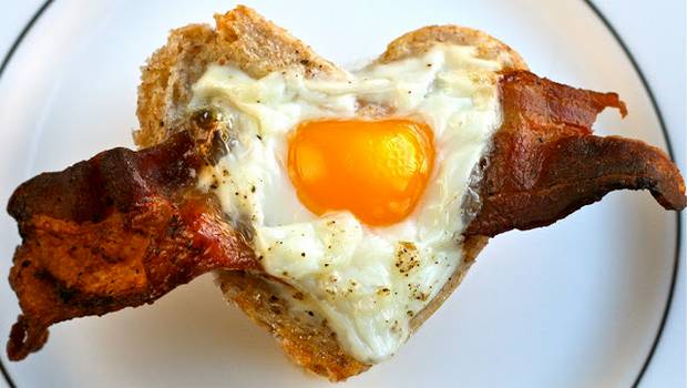 bacon, egg and toast cups baked into a heart shape