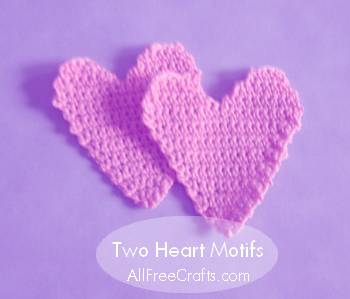 two crocheted heart motifs
