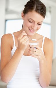 woman eating yogurt