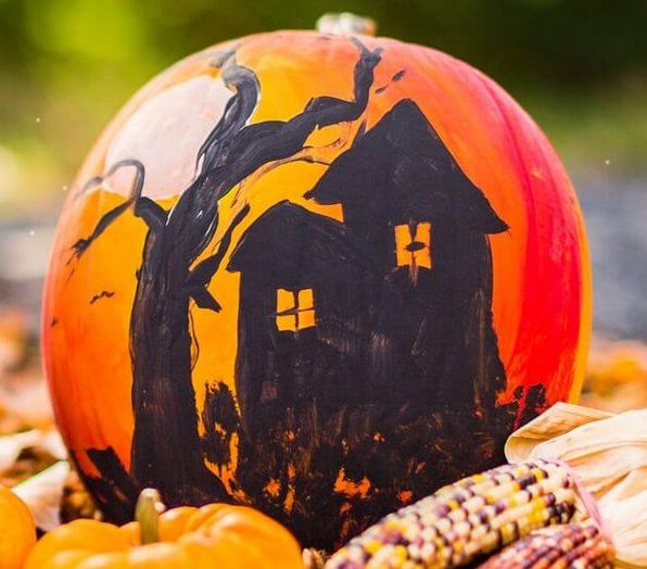 haunted house silhouette on a pumpkin