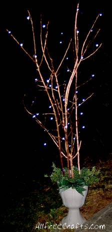 painted branches with Christmas lights