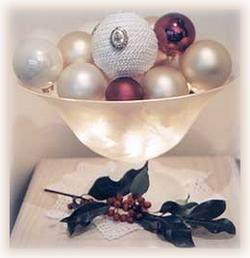 illuminated bowl of Christmas ornaments