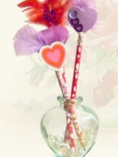 homemade valentine pencils with feathers and hearts