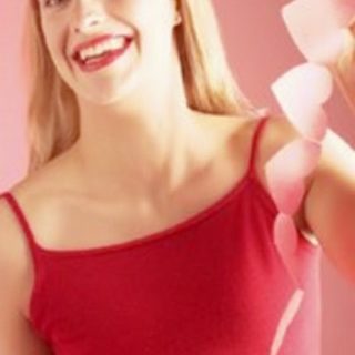 woman holding a garland of paper hearts