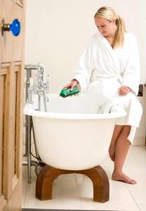 woman preparing to have a bath