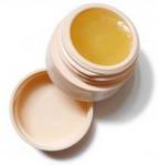 beeswax lip balm in white plastic container
