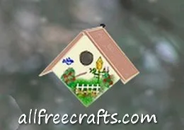 bird house with painted scene on the front