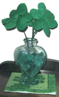 paper shamrocks in a jar