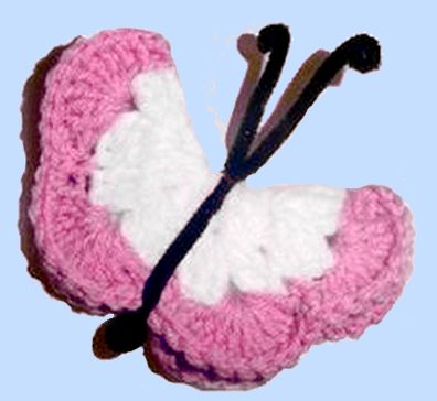 pink and white crocheted butterfly