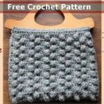 crocheted bag with wooden handles and bobble stitch crochet