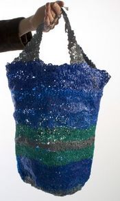 recycled tote held by handles