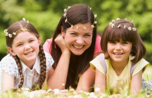 mom and daughters wearing daisy chains