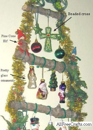 close of ornaments hanging on wall tree