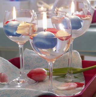 floating candles in wine glasses