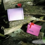 fairy mail boxes on a cedar fence