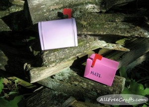 fairy mail boxes on a cedar fence