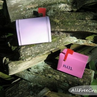 fairy mail boxes on a cedar fence