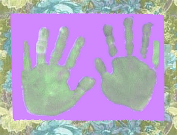 hand prints framed by wallpaper