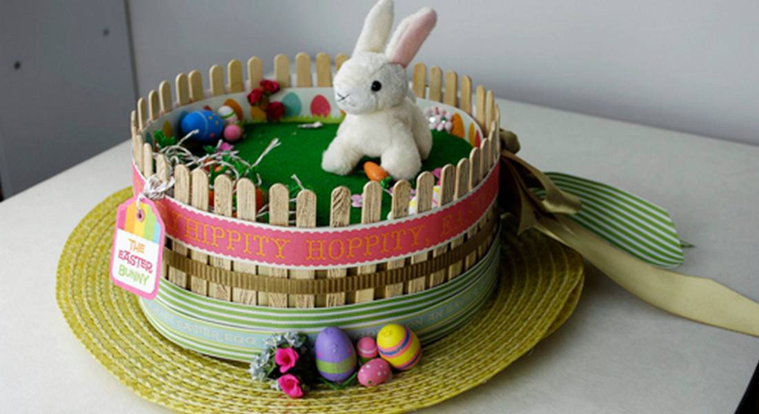 straw hat Easter bonnet with bunny and carrots