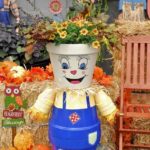 clay pot scarecrow with flowers