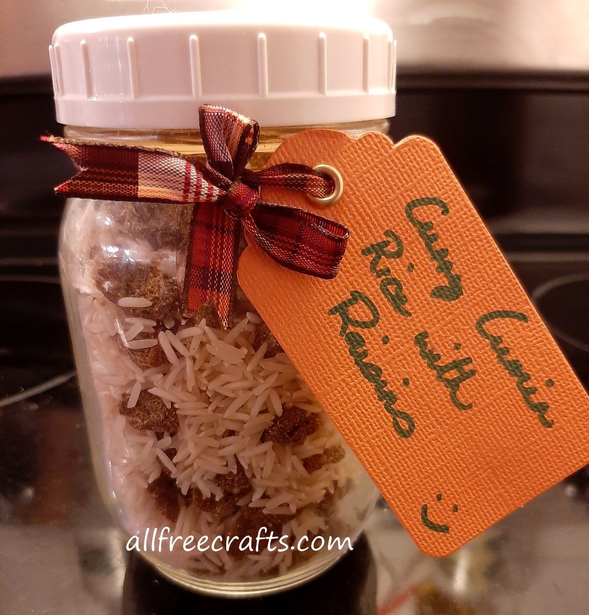curry cumin rice with raisins mix shown in a mason jar
