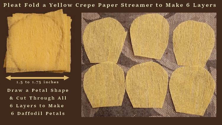 cutting daffodil petals from a crepe paper streamer