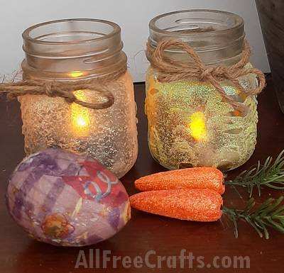 two glitter jar candles